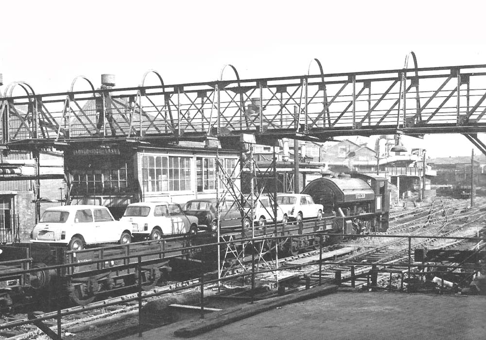 0-6-0ST 'Vulcan' shunts a train of loaded carflats past Longbridge East Signal Box on 8th September 1971