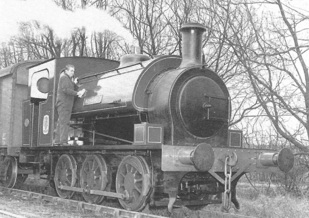 The driver takes an opportunity to add some shine to the lined green livery of 0-6-0ST �Austin 3� at Austin Motor Works