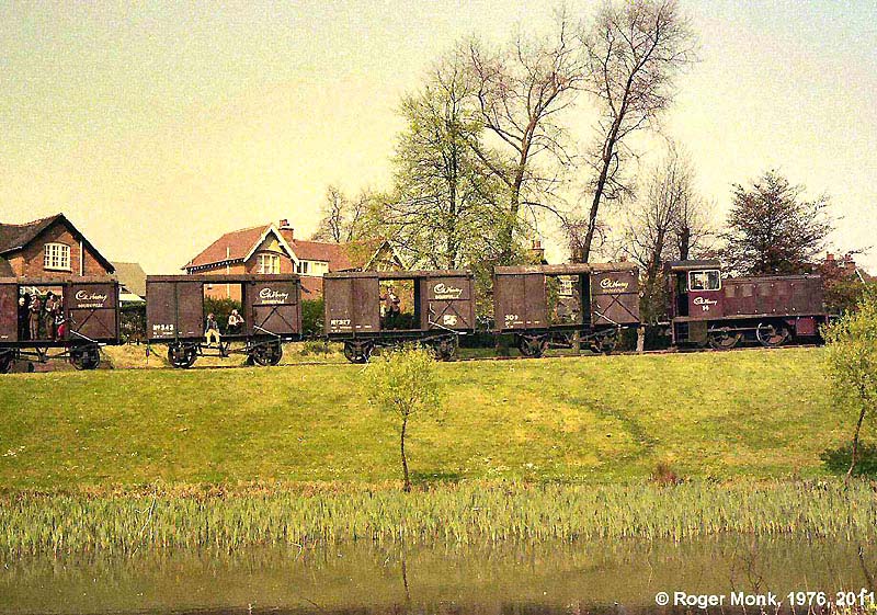 Side view of the railtour train within Cadbury's works as No 14 climbs the incline approaching the skew bridge