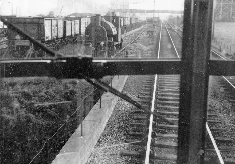 View of Coventry Gasworks with the sidings on the left and the gasometers on the right and signal box in the distance