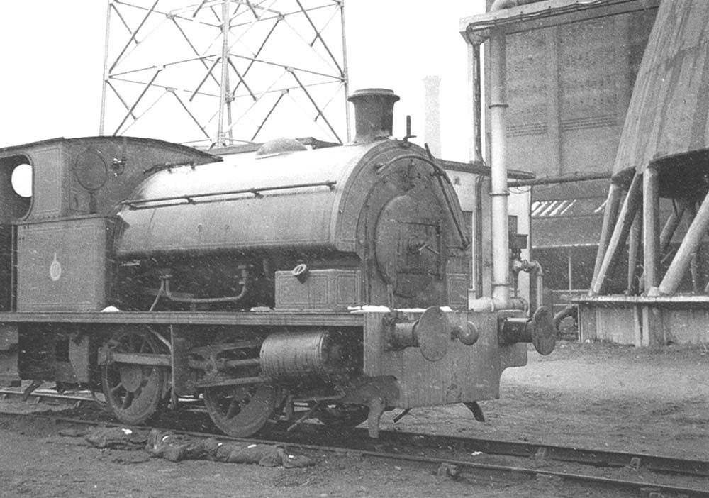One of Coventry Gas Works' little four-wheeled Bagnall locomotives stands adjacent to one of the water towers