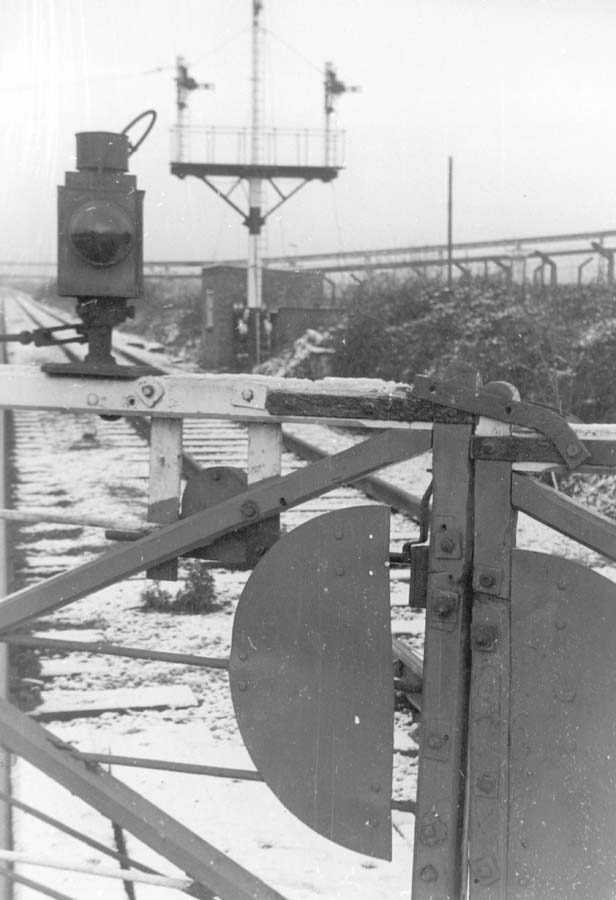 Detailed close up of the level crossing gates at Bedlam Lane looking north towards Nuneaton
