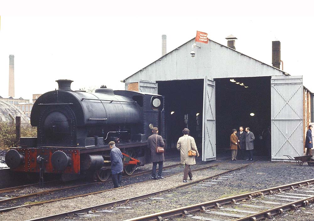 The 'Foleshill Railway Company' flag flutters above railway enthusiasts inspecting the locomotive shed