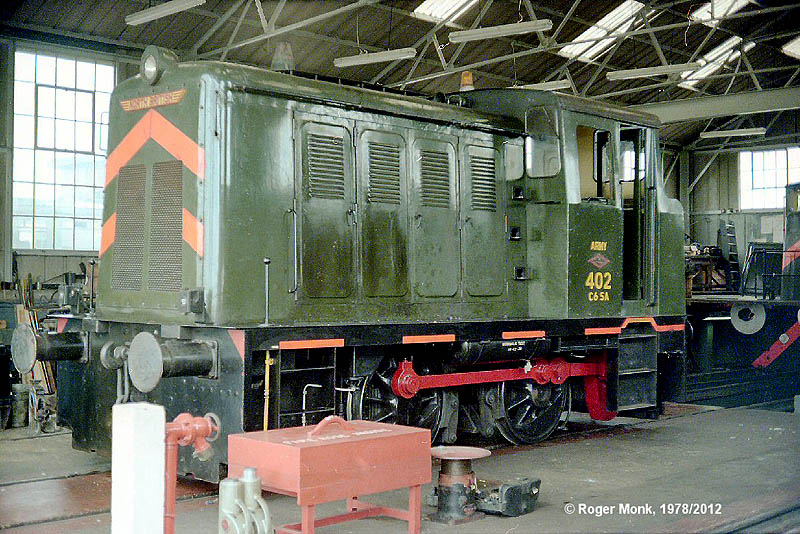 Army 402, an 0-4-0 Diesel Hydraulic locomotive, is seen under repair inside the well kept locomotive shed at Kineton