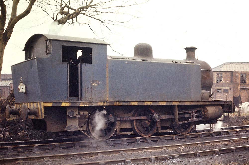 A side view of one of Nechall Power Station's RSHN locomotives standing near to the shed in November 1971